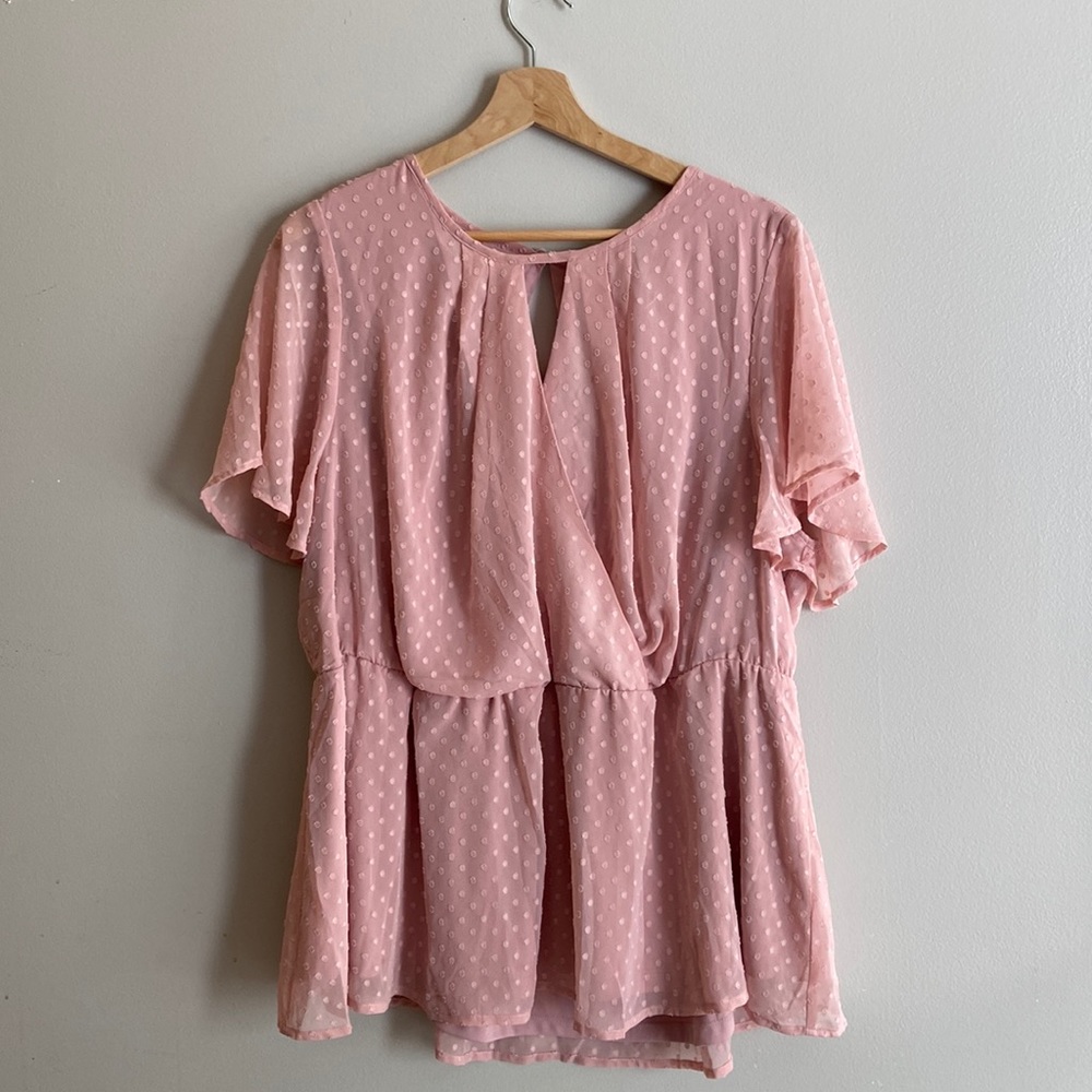 This is a beautiful pink peplum Lane Bryant top.